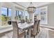 Inviting dining room with lots of windows and a decorative chandelier at 2072 Amenity Park Dr, Mount Pleasant, SC 29466