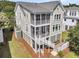 Stunning coastal home with multiple screened porches and charming architectural details at 2072 Amenity Park Dr, Mount Pleasant, SC 29466