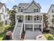 Beautiful home with a spacious front porch, grand staircase, and two-car garage at 2072 Amenity Park Dr, Mount Pleasant, SC 29466