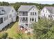 Beautiful two-story home with a screened-in porch, white stairs, and manicured lawn at 2072 Amenity Park Dr, Mount Pleasant, SC 29466