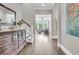 Open foyer featuring hardwood floors, a wooden dresser, and a view into the living room at 2072 Amenity Park Dr, Mount Pleasant, SC 29466