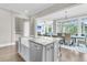 Bright kitchen island with sink, view to a dining space and comfortable Gathering room at 2072 Amenity Park Dr, Mount Pleasant, SC 29466