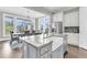 Bright, open kitchen with a large island and breakfast bar, flowing into the dining area at 2072 Amenity Park Dr, Mount Pleasant, SC 29466