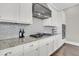 Well-equipped kitchen features granite counters, stainless hood, and white cabinetry at 2072 Amenity Park Dr, Mount Pleasant, SC 29466