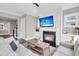 Cozy living room featuring a fireplace, ceiling fan, and neutral tones at 2072 Amenity Park Dr, Mount Pleasant, SC 29466