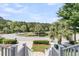 Scenic neighborhood view features lush landscaping, a pond, and a tranquil setting at 2072 Amenity Park Dr, Mount Pleasant, SC 29466