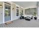 Inviting covered porch with stylish furnishings and a welcoming entryway at 2072 Amenity Park Dr, Mount Pleasant, SC 29466