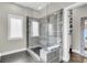 Modern shower with glass door and gray tiled walls, next to a window at 2072 Amenity Park Dr, Mount Pleasant, SC 29466