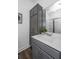 Bathroom features a gray vanity with a white countertop and a framed mirror reflecting the shower at 208 Cache Ct, Charleston, SC 29414