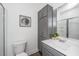Bathroom with gray cabinets, dual sinks, and modern fixtures at 208 Cache Ct, Charleston, SC 29414