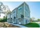 New townhomes with modern siding and well-manicured lawns in a desirable neighborhood at 208 Cache Ct, Charleston, SC 29414