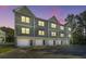 Modern townhome with attached garages, gray siding, and well-maintained landscaping at 208 Cache Ct, Charleston, SC 29414