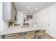 Kitchen island with granite countertop, sink, and seating area at 208 Cache Ct, Charleston, SC 29414