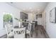 Stylish kitchen with gray cabinets, granite countertops, and a breakfast bar seating area at 208 Cache Ct, Charleston, SC 29414
