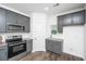 Well-equipped kitchen with stainless steel appliances, gray cabinetry, and granite countertops at 208 Cache Ct, Charleston, SC 29414