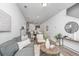 Spacious living area featuring a cozy sofa, stylish decor, and a clear view of the modern kitchen at 208 Cache Ct, Charleston, SC 29414
