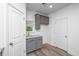 Walk-in pantry with gray cabinets and granite countertop at 208 Cache Ct, Charleston, SC 29414