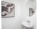 Clean powder room with a pedestal sink and round mirror at 208 Cache Ct, Charleston, SC 29414