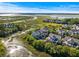A high angle captures beautiful coastal homes within a thriving marsh and winding creek community with an ocean backdrop at 2087 Sterling Marsh Ln, Seabrook Island, SC 29455