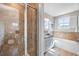Bathroom featuring tiled glass shower, separate soaking tub, and a granite-topped vanity with ample lighting at 2087 Sterling Marsh Ln, Seabrook Island, SC 29455