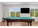 Bright billiard room with a pool table and scenic outdoor views at 2087 Sterling Marsh Ln, Seabrook Island, SC 29455