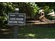 Community signage for Lake House Nature Trail and playground in a common area at 2087 Sterling Marsh Ln, Seabrook Island, SC 29455