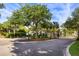 A grand entrance to a luxurious neighborhood, featuring a secure gate, mature trees, and elegant signage at 2087 Sterling Marsh Ln, Seabrook Island, SC 29455