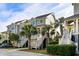Charming two-story townhome with beautifully landscaped grounds and palm trees at 2087 Sterling Marsh Ln, Seabrook Island, SC 29455