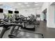 Well-equipped fitness center with treadmills, elliptical machines, and natural light at 2087 Sterling Marsh Ln, Seabrook Island, SC 29455