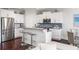 Modern kitchen featuring stainless steel appliances, granite countertops, and stylish bar seating at 2087 Sterling Marsh Ln, Seabrook Island, SC 29455