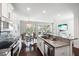 Bright, open kitchen featuring granite countertops, stainless steel appliances, and seamless flow to the dining area at 2087 Sterling Marsh Ln, Seabrook Island, SC 29455