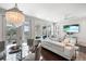 Stylish living and dining area with a modern chandelier and elegant furnishings at 2087 Sterling Marsh Ln, Seabrook Island, SC 29455