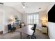 Bright home office featuring a modern desk, accent furniture, and nautical décor creates a stylish workspace at 2087 Sterling Marsh Ln, Seabrook Island, SC 29455