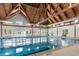 Indoor pool area features a stunning vaulted ceiling and bright, natural light at 2087 Sterling Marsh Ln, Seabrook Island, SC 29455