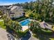 A serene pool with a cabana is enclosed by manicured hedges, offering a private and refreshing escape at 2087 Sterling Marsh Ln, Seabrook Island, SC 29455