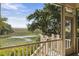 Enjoy serene outdoor views from this porch, complete with a sturdy railing and a glimpse of the surrounding landscape at 2087 Sterling Marsh Ln, Seabrook Island, SC 29455