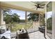 Relaxing screened porch features comfortable seating, wicker furniture, and scenic outdoor views at 2087 Sterling Marsh Ln, Seabrook Island, SC 29455