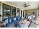 Inviting screened porch with comfortable seating and stylish decor at 2087 Sterling Marsh Ln, Seabrook Island, SC 29455