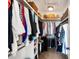 Spacious walk-in closet with organized shelving and hanging rods provides ample storage for clothes and accessories at 2087 Sterling Marsh Ln, Seabrook Island, SC 29455