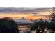 Tranquil water view at sunset, reflecting the sky's vibrant colors amidst trees, promising serene living at 2087 Sterling Marsh Ln, Seabrook Island, SC 29455