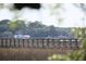 Scenic waterfront view with a weathered pier and two fishing boats beyond at 2087 Sterling Marsh Ln, Seabrook Island, SC 29455