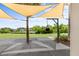 Outdoor workout area featuring a heavy bag and sunshade, overlooking lush landscaping at 2087 Sterling Marsh Ln, Seabrook Island, SC 29455