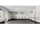 Spacious workout room featuring wood ballet bars, dumbbells, and mounted heating lamps at 2087 Sterling Marsh Ln, Seabrook Island, SC 29455