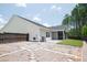 Backyard featuring gravel landscaping and a screened-in porch at 209 Country Gate Ln, Summerville, SC 29485