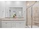 Bathroom with granite countertops, dual sinks and glass shower with decorative tile at 209 Country Gate Ln, Summerville, SC 29485