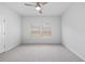 A bright bedroom with two windows, neutral tones, and carpeted flooring at 209 Country Gate Ln, Summerville, SC 29485