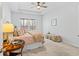 Spacious bedroom with a ceiling fan, carpet and a side table with a lamp at 209 Country Gate Ln, Summerville, SC 29485