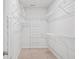 Walk-in closet featuring adjustable white wire shelving and a white door at 209 Country Gate Ln, Summerville, SC 29485