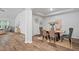 Dining room with modern table and chairs and light-colored wood floors at 209 Country Gate Ln, Summerville, SC 29485