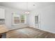 Cozy dining room with natural light, chandelier, and access to the rear patio at 209 Country Gate Ln, Summerville, SC 29485